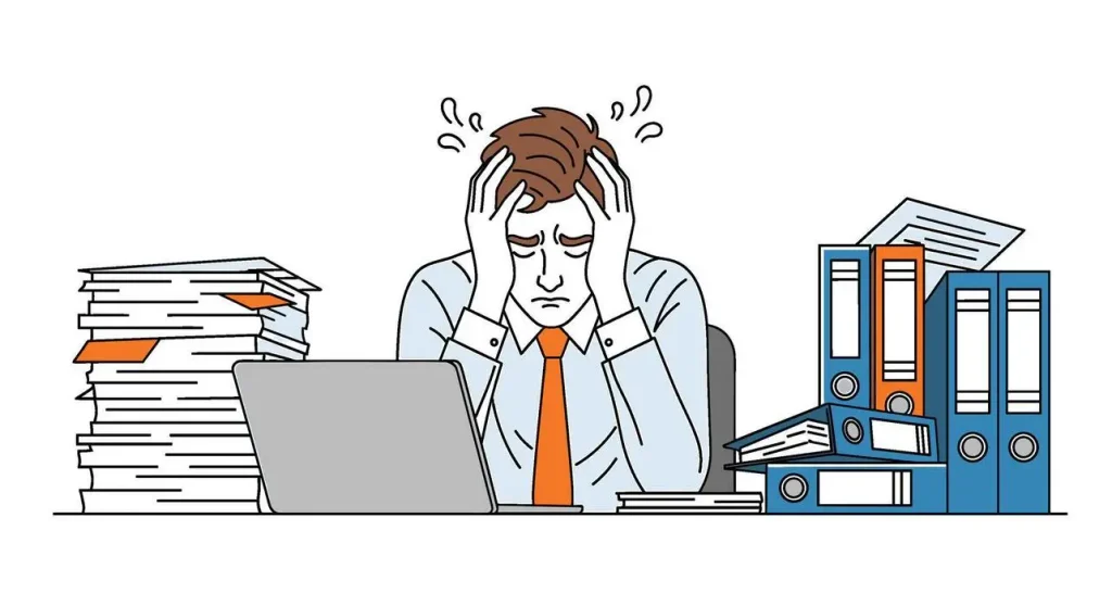 Overwhelmed worker holding a HELP sign behind a massive stack of paperwork and bills.